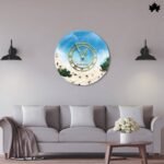 Coastal Breeze - Luxury Wall Clock | Fankaarlok: A contemporary wall clock featuring a tranquil coastal design with golden hour hands, set against a backdrop of soft blue skies and creamy sand textures, perfectly suited for a modern living room setting.