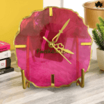 Chic Cerise Quartz Modern Designer Clock featuring vibrant pink resin art and modern gold accents, set in a uniquely shaped and designed case, ideal for adding a pop of color and style to any room. This designer clock by Fankaarlok combines functionality with aesthetic appeal, perfect for contemporary interiors.